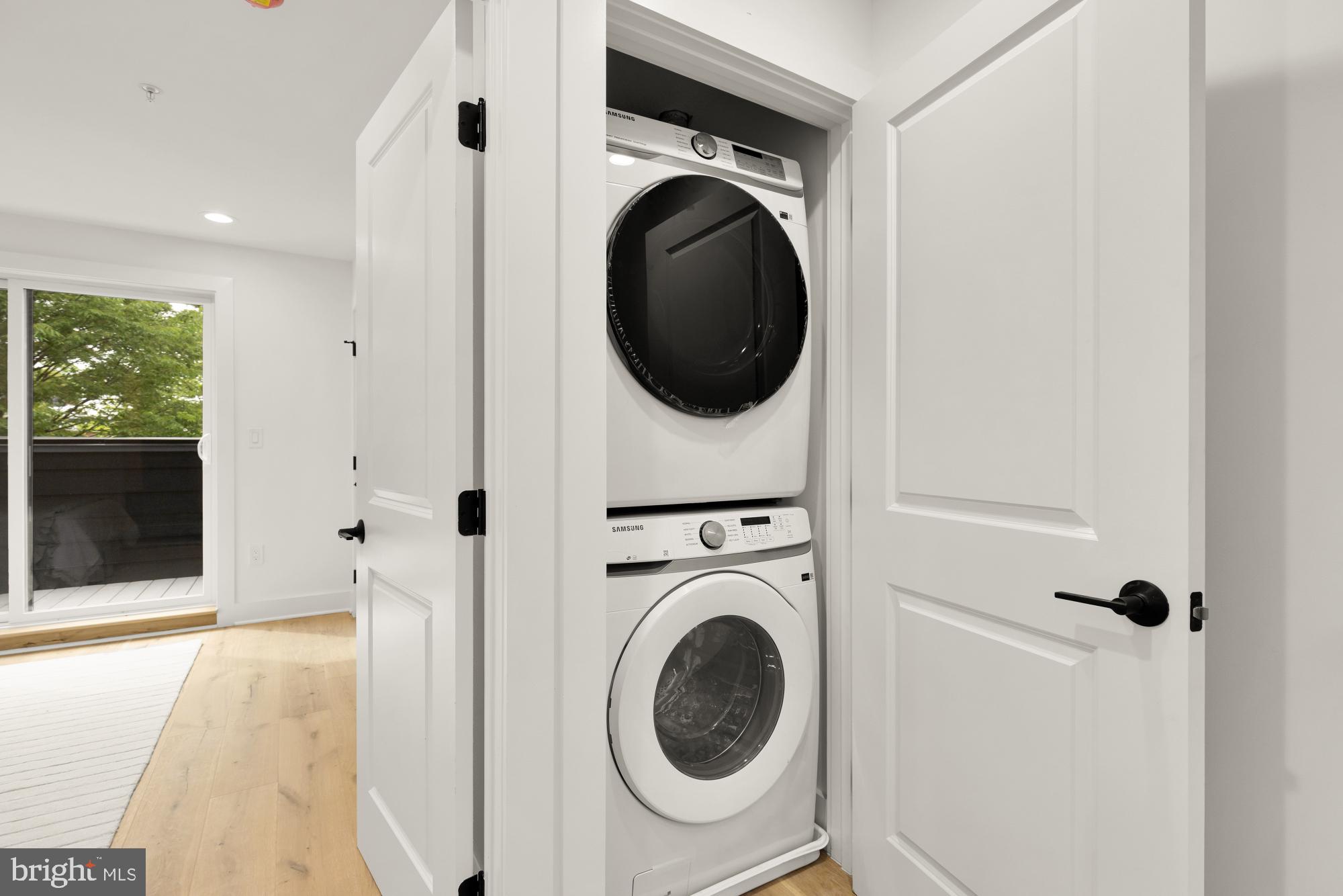 1325 Orren Street Northeast, Unit D Washington, DC 20002 - Photo 40 of 44 a view of a hallway with washer and dryer
