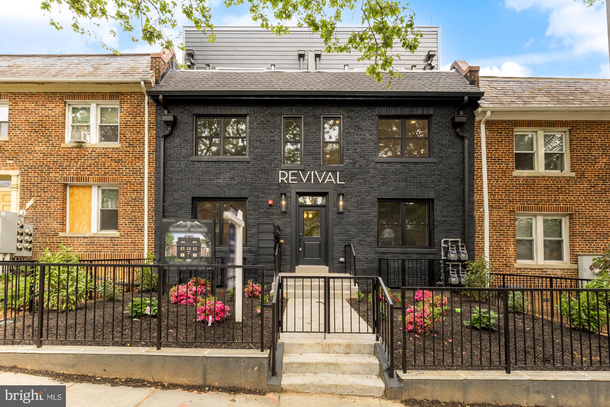 1325 Orren Street Northeast, Unit D Washington, DC 20002 - Photo 41 of 44 a front view of a house with glass windows