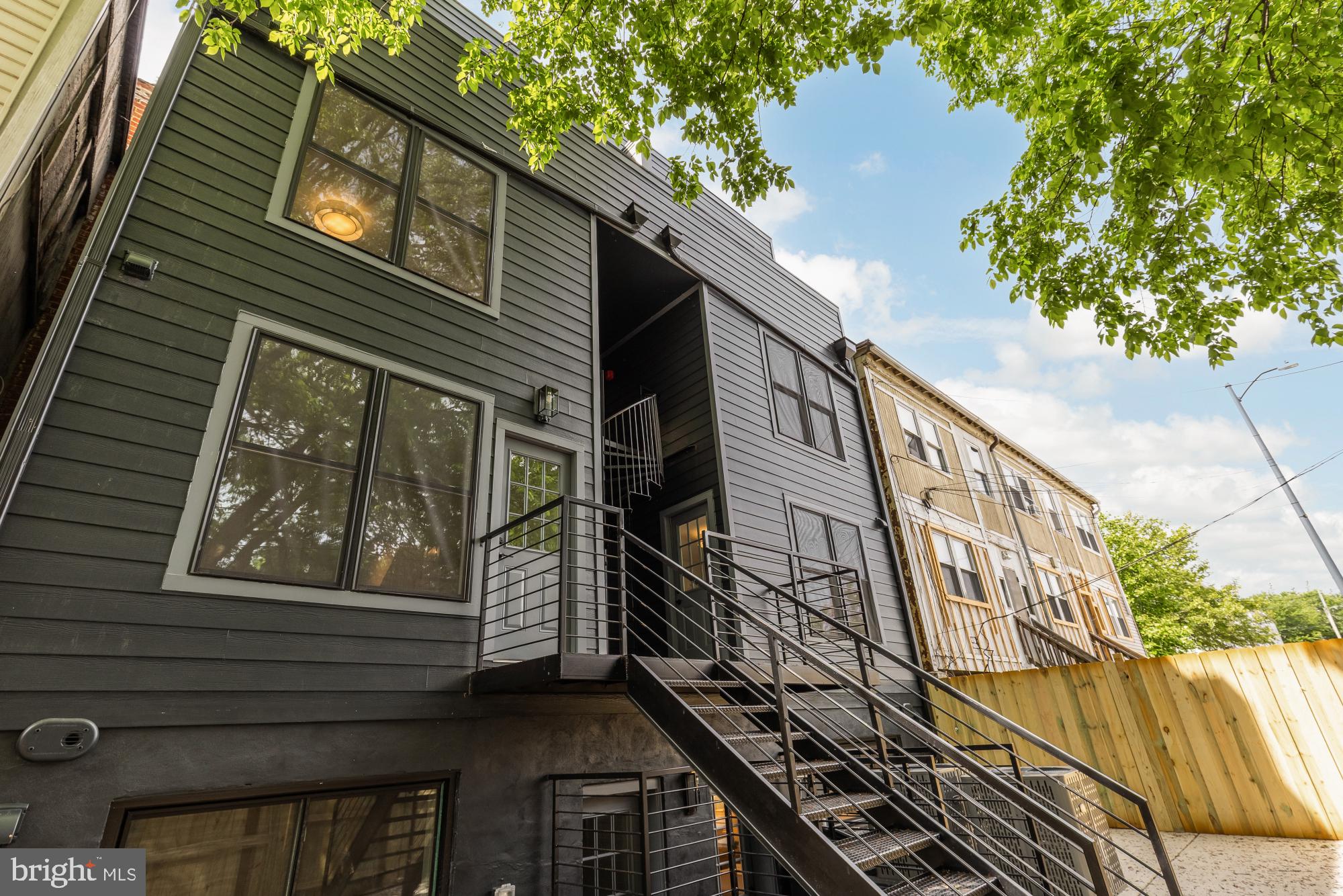 1325 Orren Street Northeast, Unit D Washington, DC 20002 - Photo 43 of 44 a view of a house with a small yard