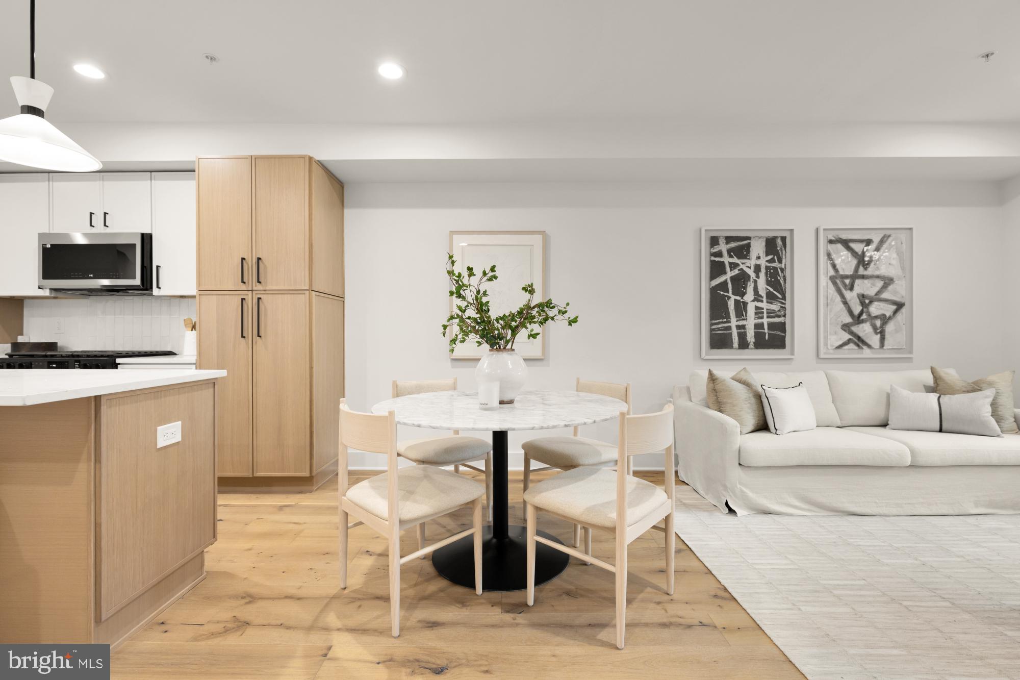1325 Orren Street Northeast, Unit D Washington, DC 20002 - Photo 7 of 44 a living room with furniture a flat screen tv and a refrigerator