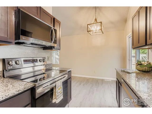 an empty room with closet and mirror