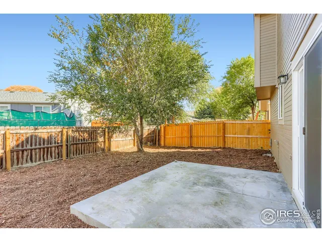a house view with a backyard space