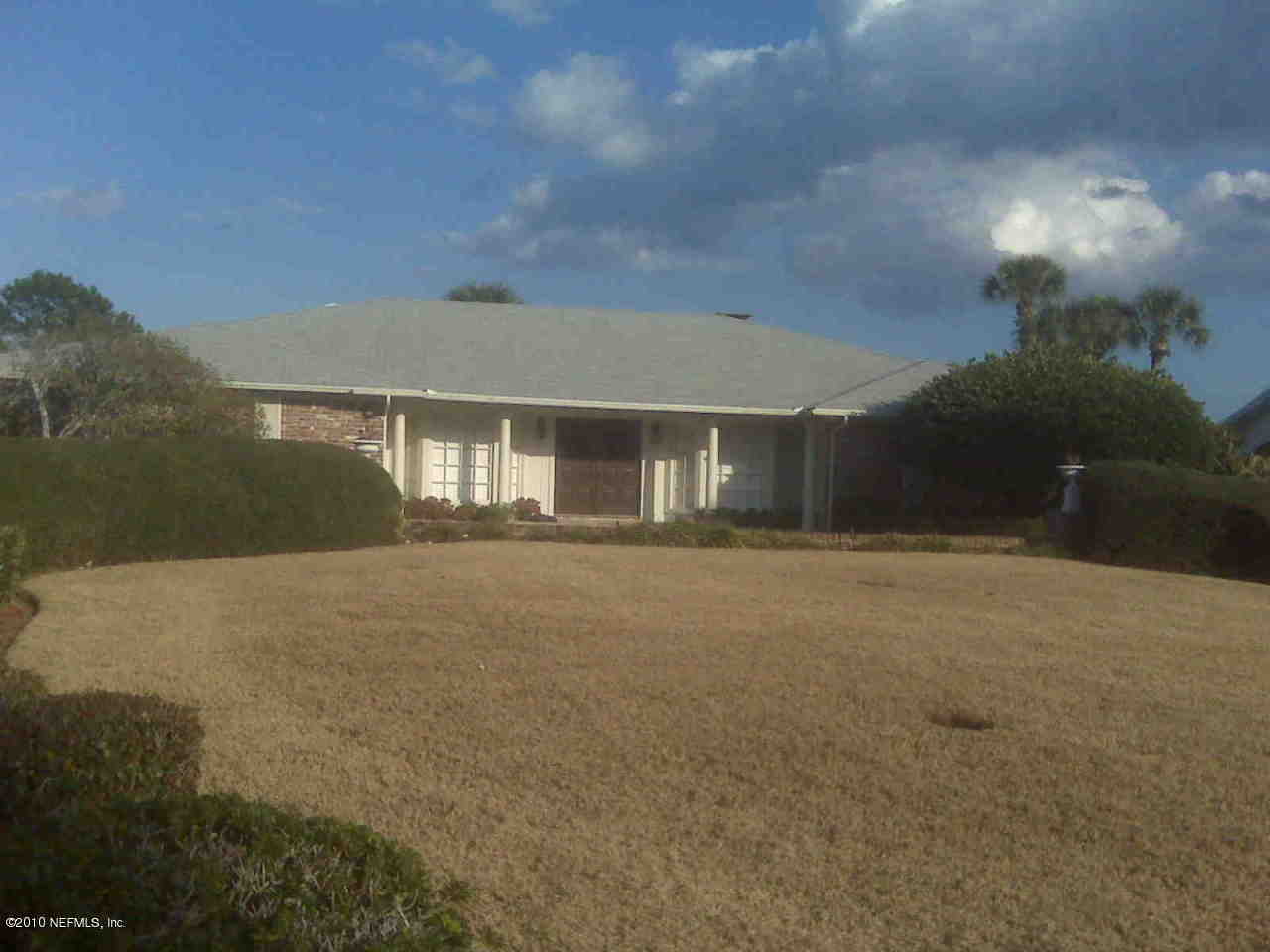 239 Pablo Road Ponte Vedra Beach, FL 32082 - Photo 1 of 13 a front view of a house with a yard and garage