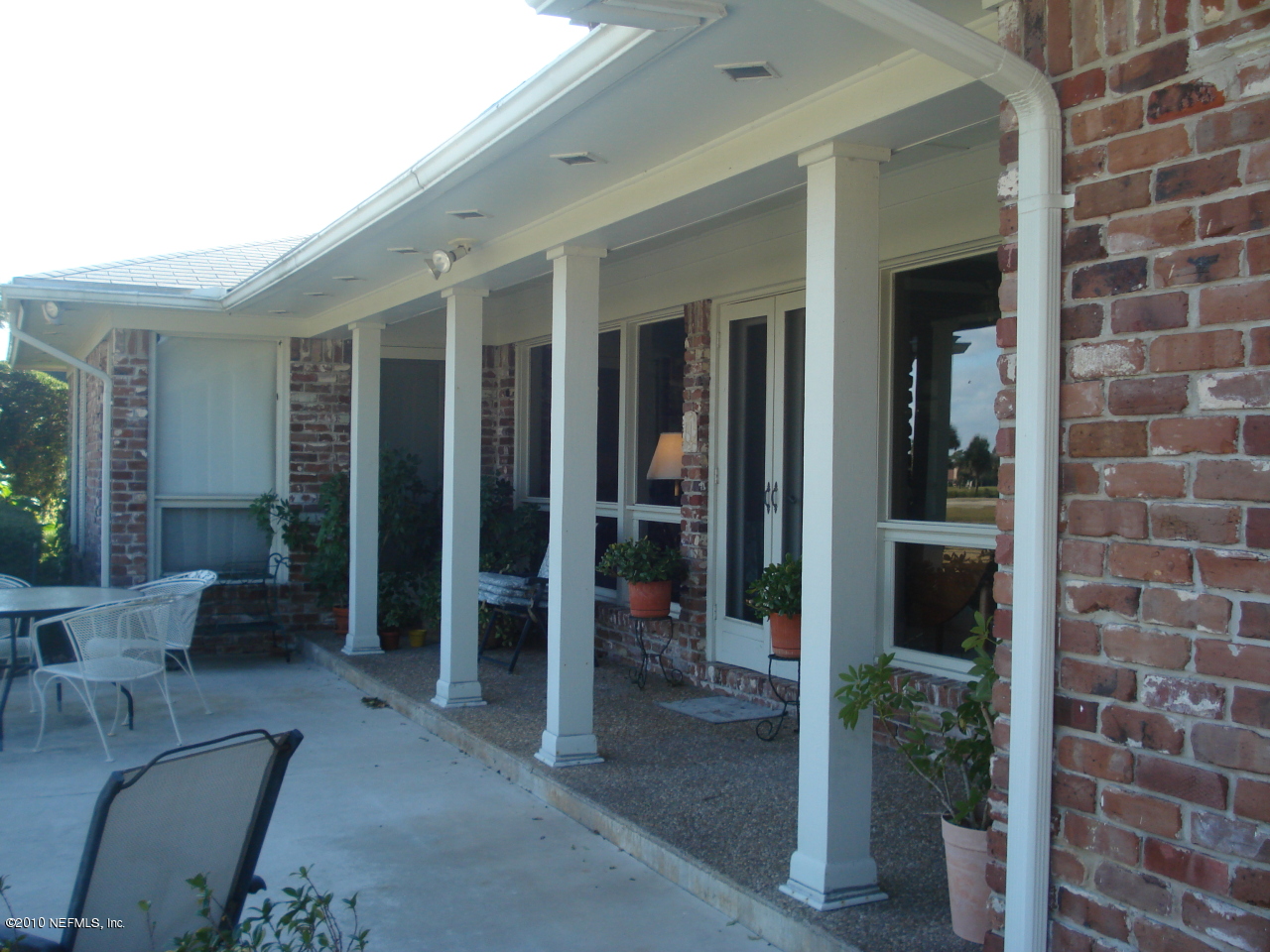 239 Pablo Road Ponte Vedra Beach, FL 32082 - Photo 3 of 13 a view of a patio with table and chairs and potted plant