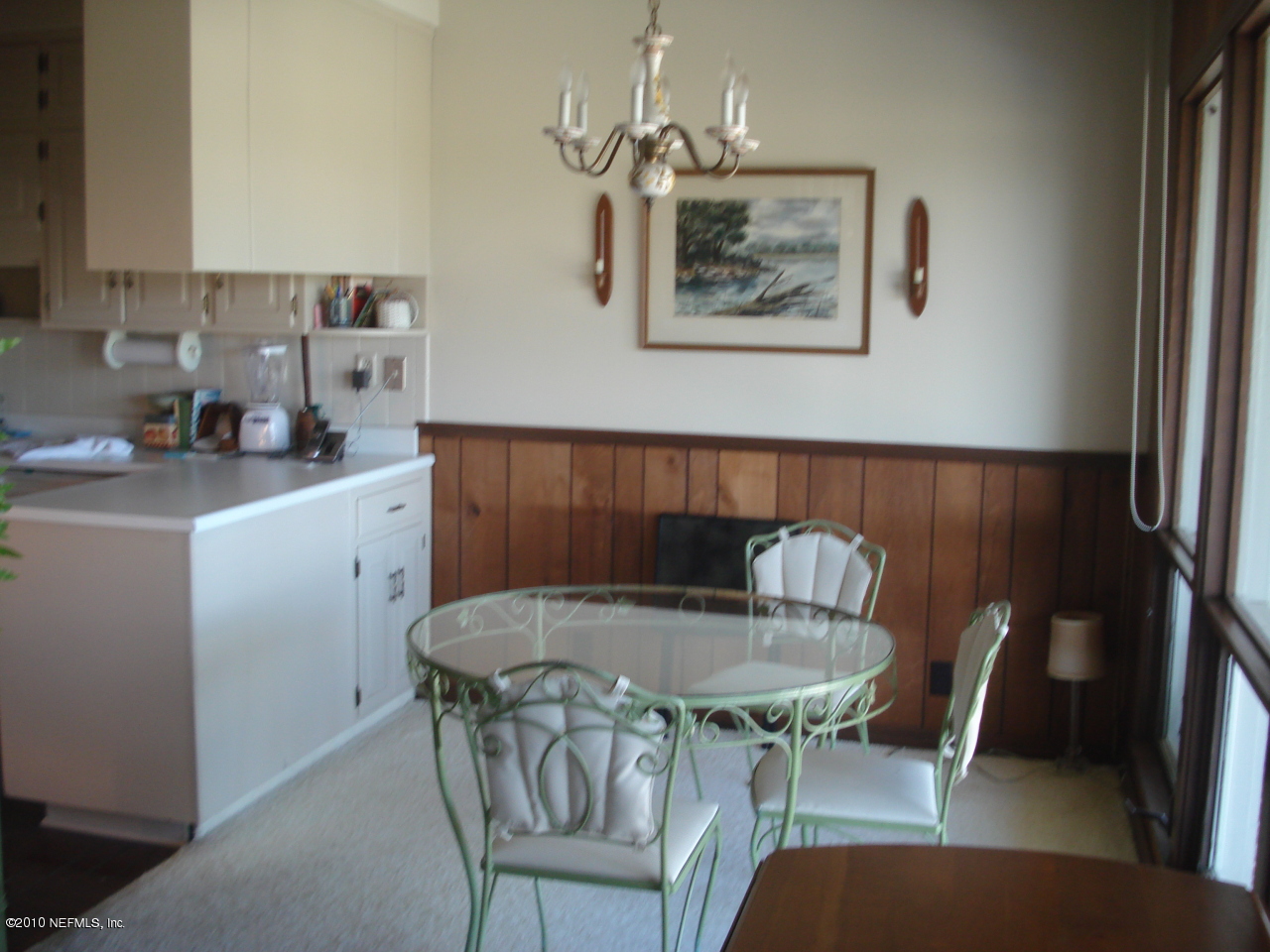239 Pablo Road Ponte Vedra Beach, FL 32082 - Photo 6 of 13 a kitchen with a table chairs and a refrigerator