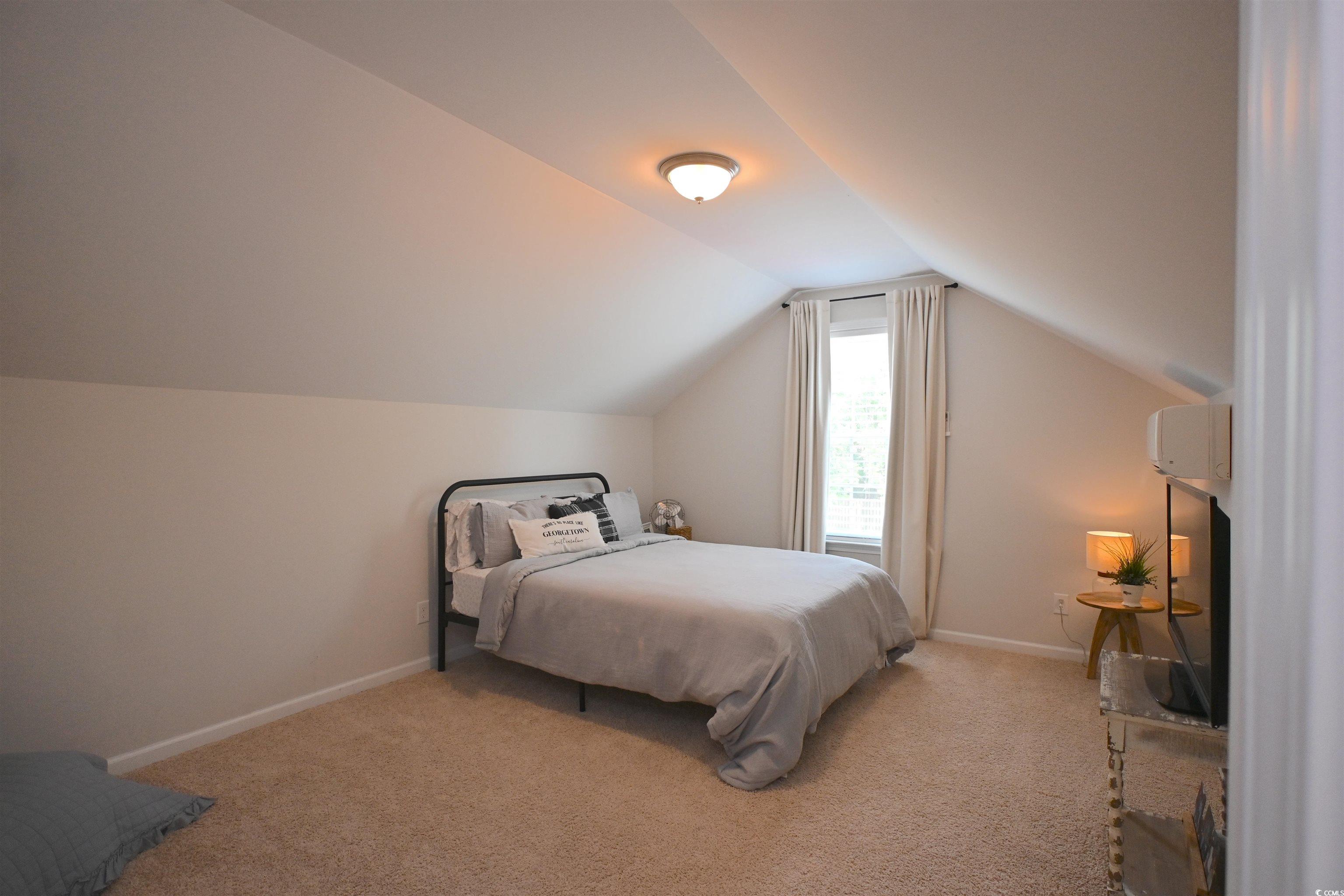 523 Charlton Boulevard Georgetown, SC 29440 - Photo 20 of 33 Carpeted bedroom with lofted ceiling and baseboards