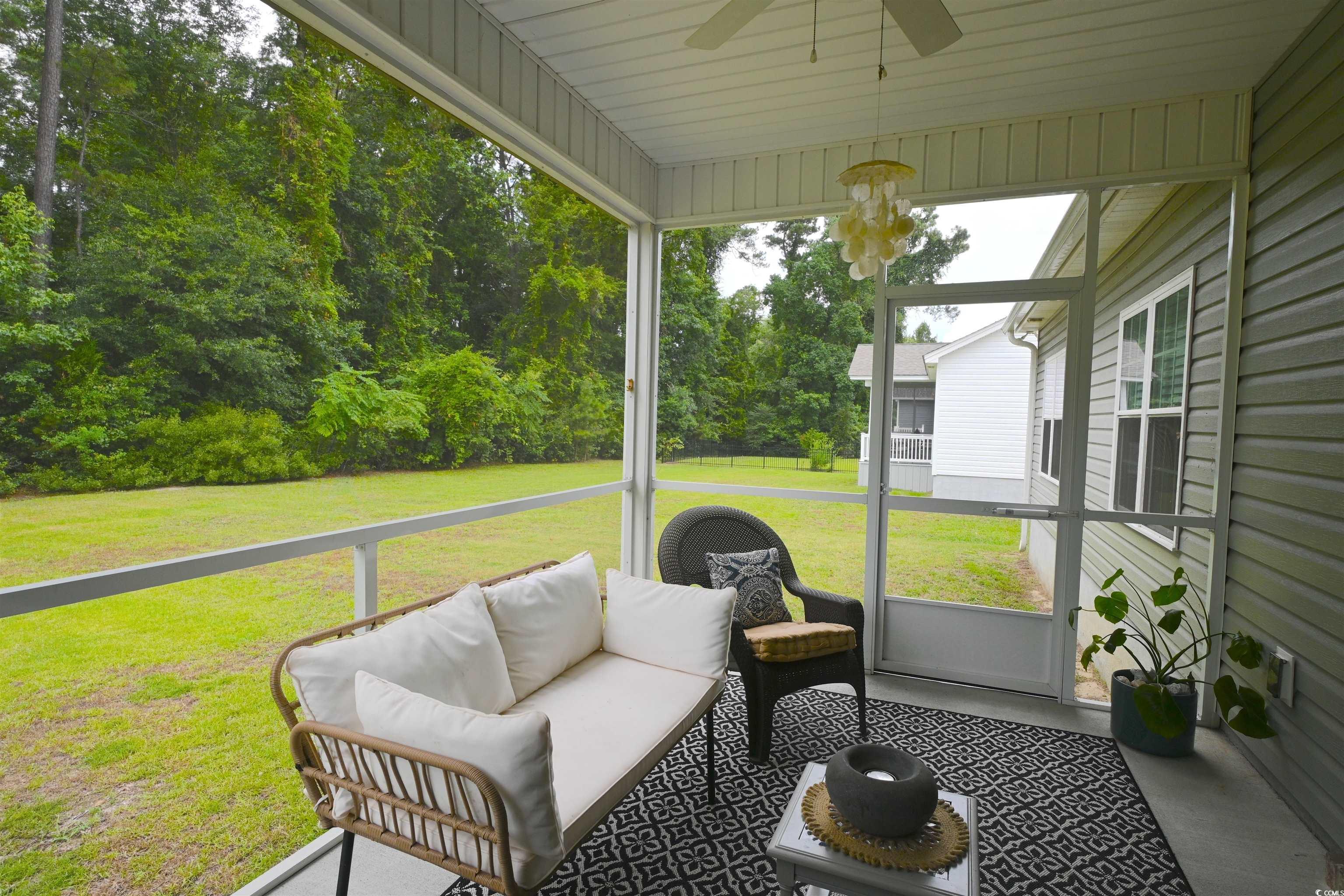 523 Charlton Boulevard Georgetown, SC 29440 - Photo 24 of 33 Sunroom with ceiling fan and outdoor lounge area