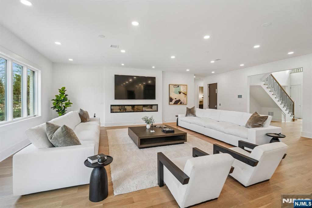 50 Roberts Road Englewood Cliffs, NJ 07632 - Photo 12 of 50 a living room with furniture and a flat screen tv