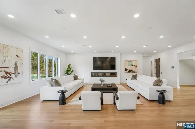 a living room with furniture or couch and a flat screen tv