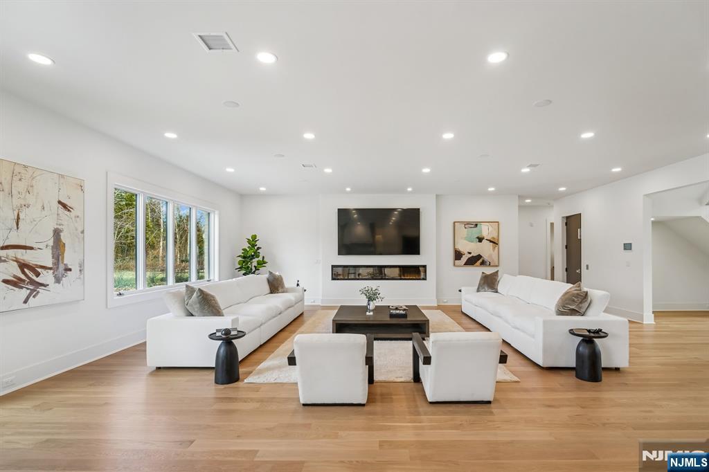 50 Roberts Road Englewood Cliffs, NJ 07632 - Photo 13 of 50 a living room with furniture or couch and a flat screen tv