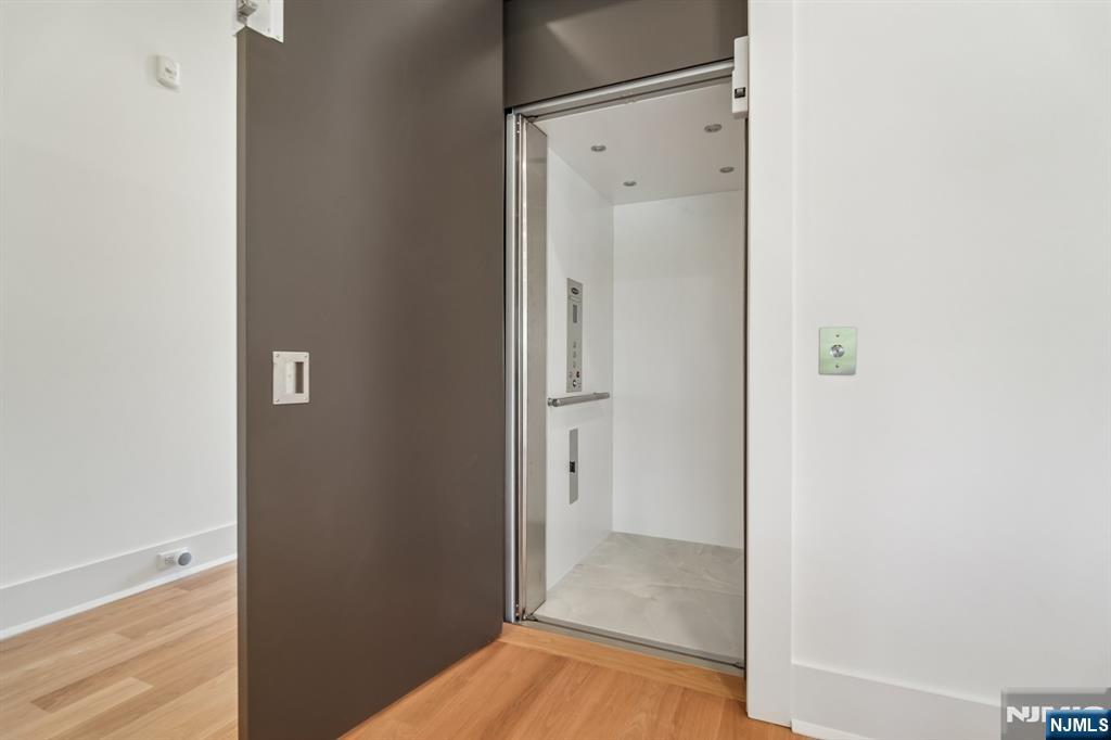 50 Roberts Road Englewood Cliffs, NJ 07632 - Photo 18 of 50 a view of a hallway with wooden floor