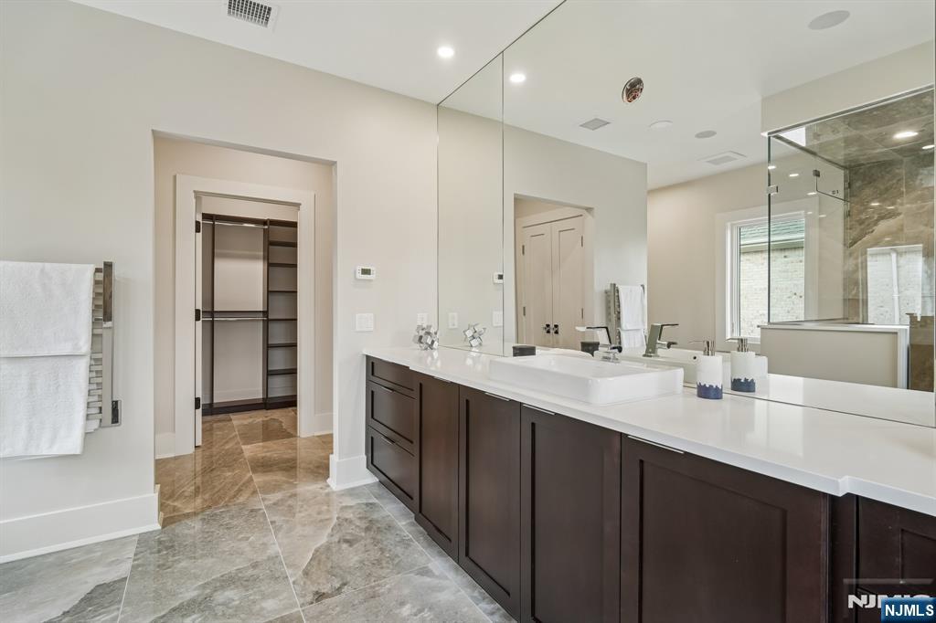 50 Roberts Road Englewood Cliffs, NJ 07632 - Photo 32 of 50 a bathroom with a double vanity sink mirror and double