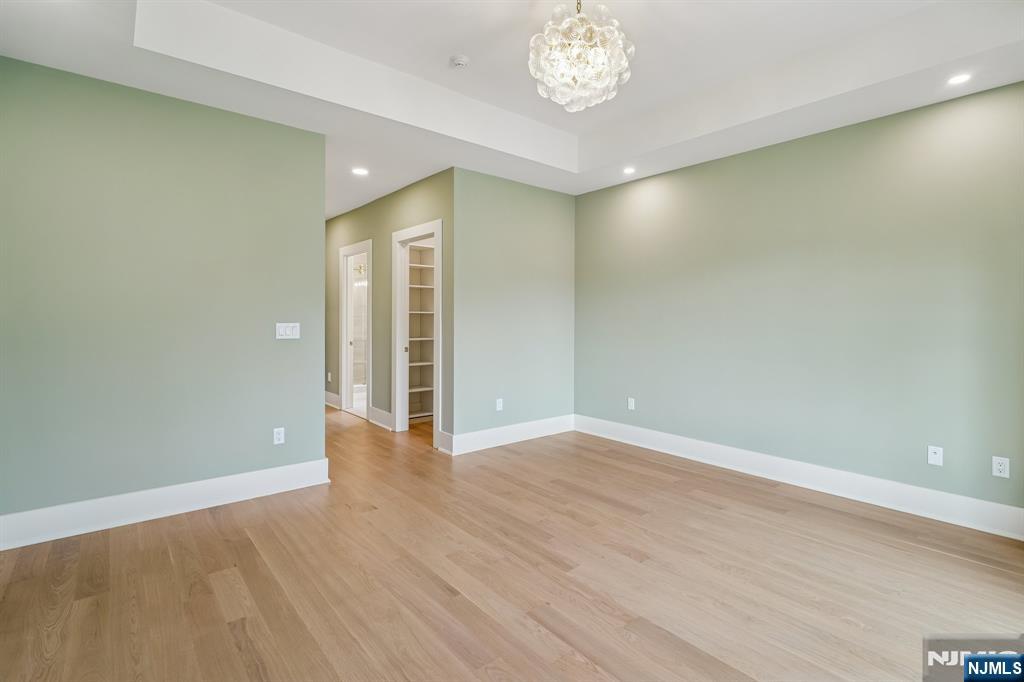 50 Roberts Road Englewood Cliffs, NJ 07632 - Photo 34 of 50 a view of an empty room with wooden floor