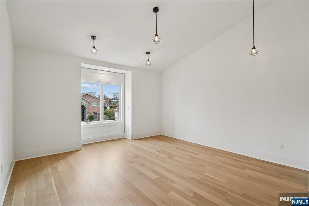 50 Roberts Road Englewood Cliffs, NJ 07632 - Photo 36 of 50 a view of an empty room with wooden floor and a window