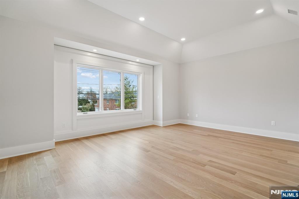 50 Roberts Road Englewood Cliffs, NJ 07632 - Photo 38 of 50 a view of an empty room with wooden floor and a window