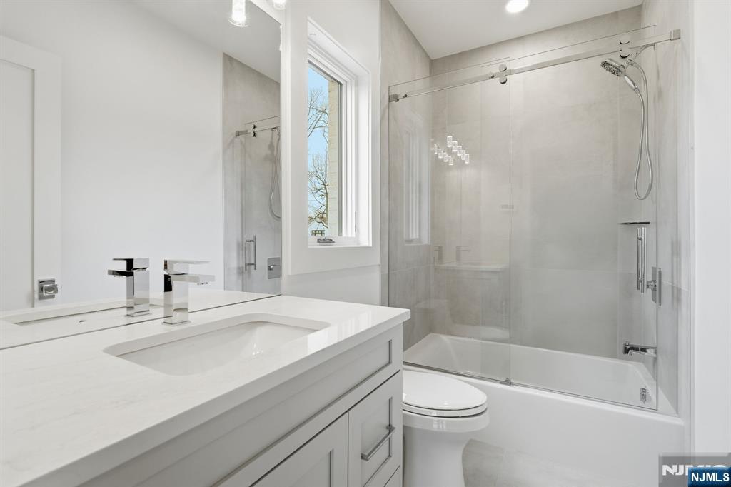 50 Roberts Road Englewood Cliffs, NJ 07632 - Photo 39 of 50 a bathroom with a sink toilet and shower