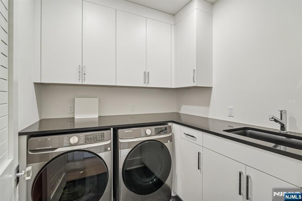 50 Roberts Road Englewood Cliffs, NJ 07632 - Photo 41 of 50 a view of storage and utility room with washer and dryer