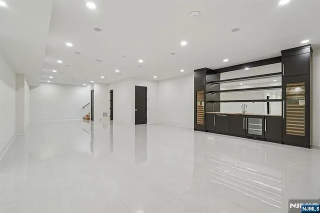 a view of an empty room with a fireplace