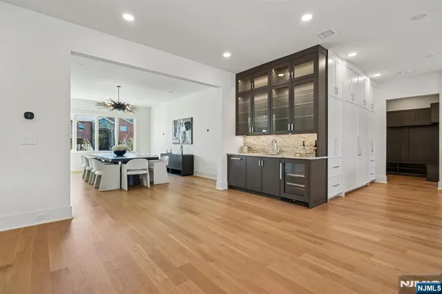 a living room with furniture and large windows