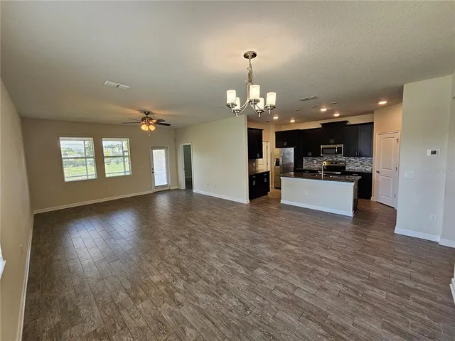 a view of a livingroom with a kitchen
