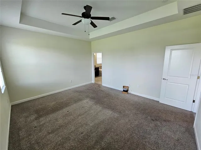 a view of a big room with carpet