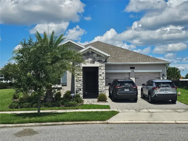 a view of a car parked in front of a house