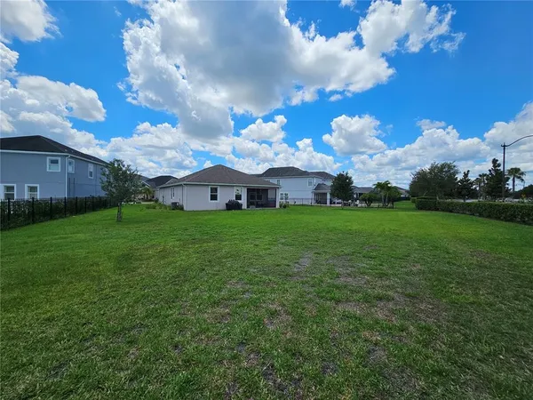 a view of a building in the middle of a field