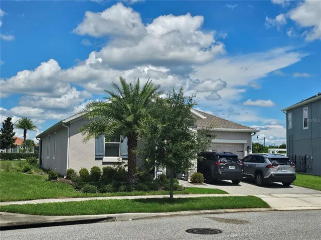 a view of a parked cars in front of a house