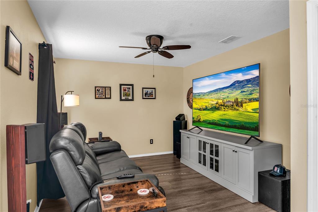 2962 Inca Avenue Clermont, FL 34715 - Photo 23 of 55 a living room with furniture and a flat screen tv