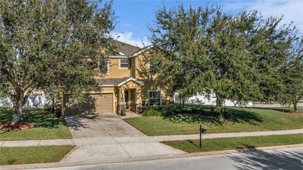 2962 Inca Avenue Clermont, FL 34715 - Photo 3 of 55 a front view of a house with a yard