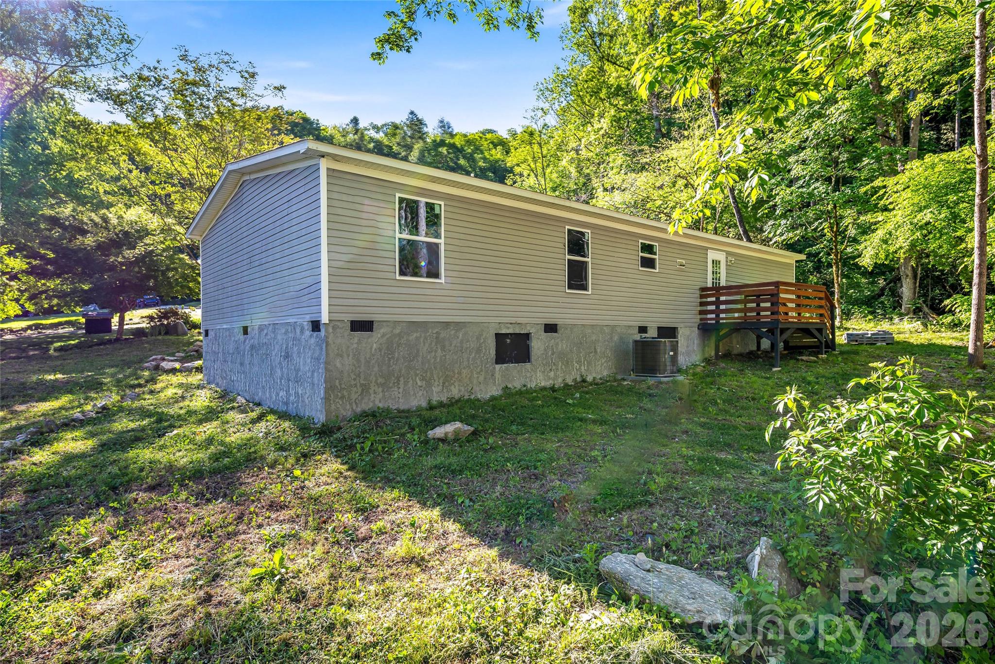 45 Alan Retreat Road Hendersonville, NC 28792 - Photo 25 of 25 a view of a backyard with plants and a garden