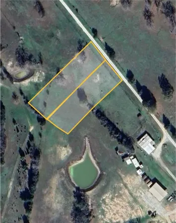 a view of a golf course with a lake