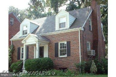 6008 39th Place Hyattsville, MD 20782 - Photo 1 of 1 a view of a brick house next to a yard