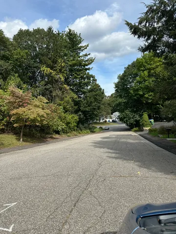 a view of a road with a building in the background