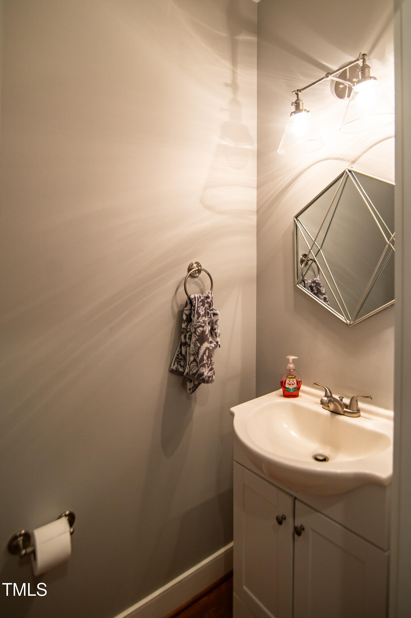 2220 Dunlin Lane Raleigh, NC 27614 - Photo 16 of 38 a bathroom with a sink and a mirror