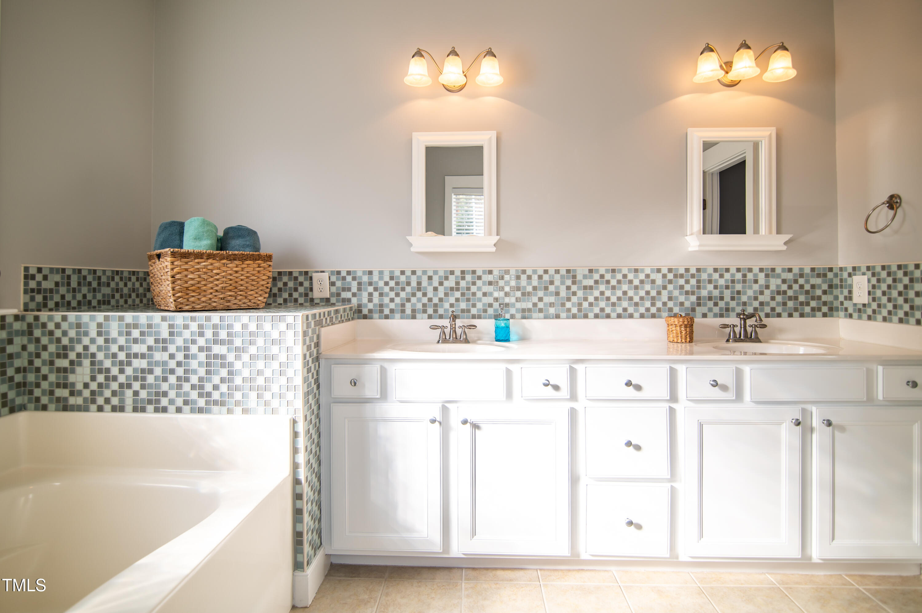 2220 Dunlin Lane Raleigh, NC 27614 - Photo 24 of 38 a bathroom with a sink tub and a mirror