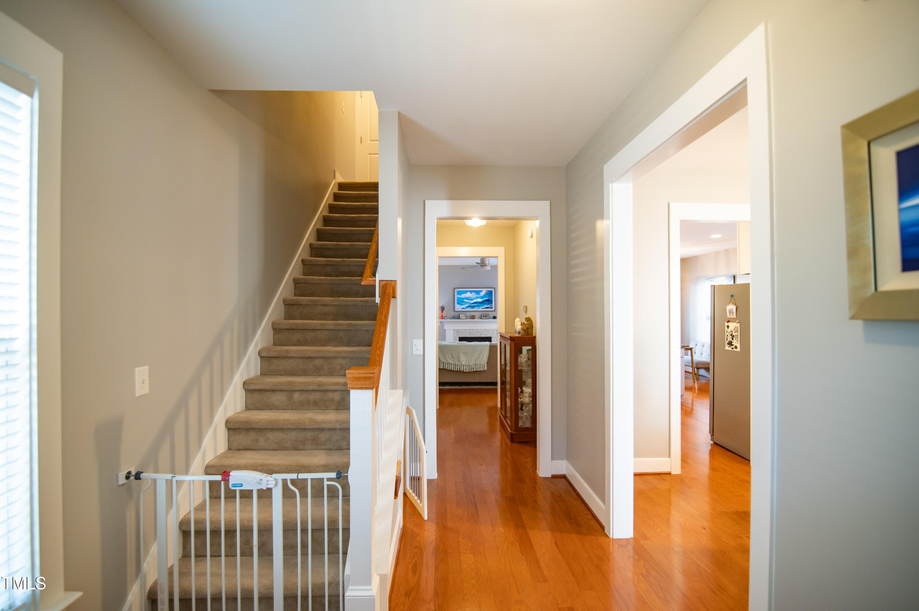 2220 Dunlin Lane Raleigh, NC 27614 - Photo 5 of 38 a view of a hallway with wooden floor and staircase