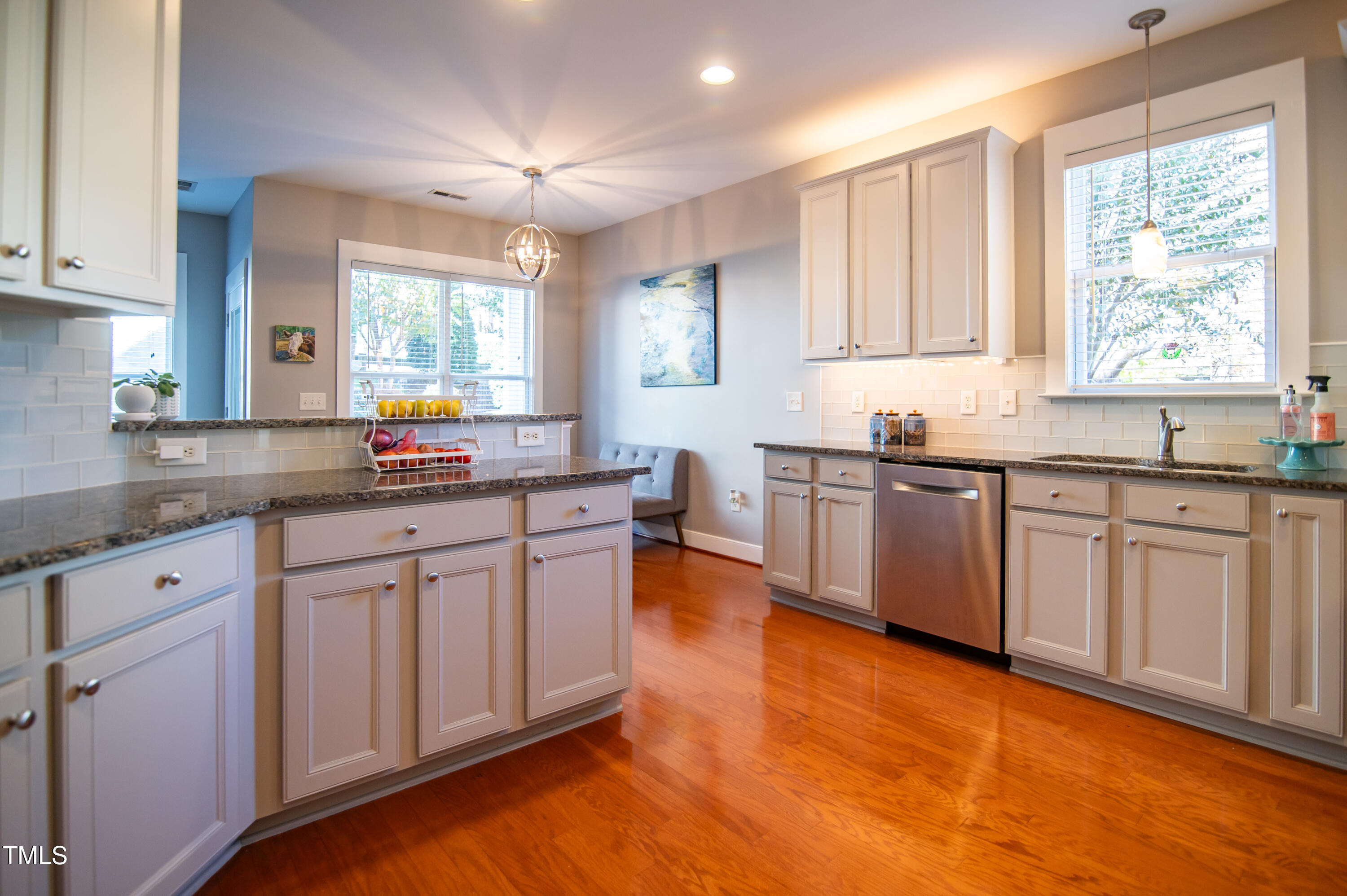 2220 Dunlin Lane Raleigh, NC 27614 - Photo 9 of 38 a kitchen with granite countertop a sink cabinets and window