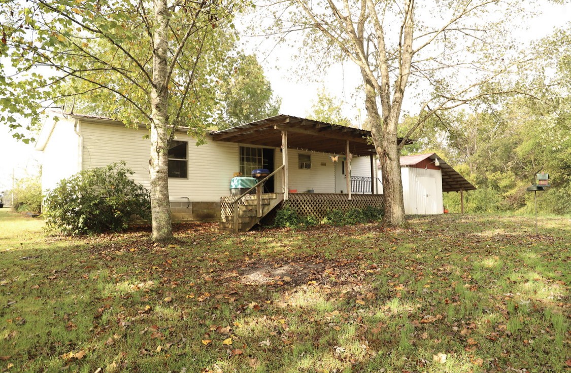 913 Maddox Road Centerville, TN 37033 - Photo 17 of 20 a front view of a house with a yard