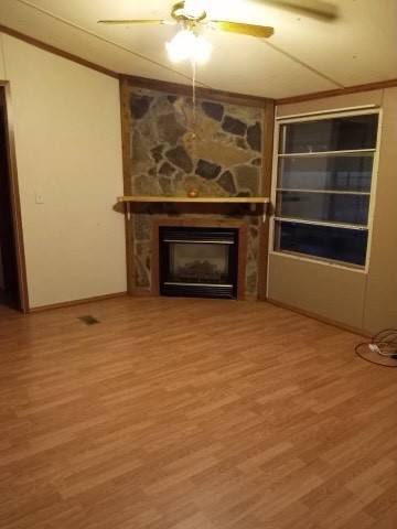 913 Maddox Road Centerville, TN 37033 - Photo 2 of 20 a view of an empty room with a fireplace and a window
