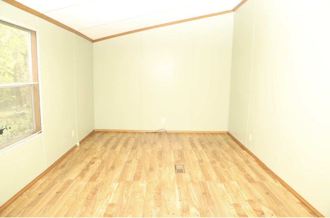 913 Maddox Road Centerville, TN 37033 - Photo 6 of 20 a view of a room with a wooden floor