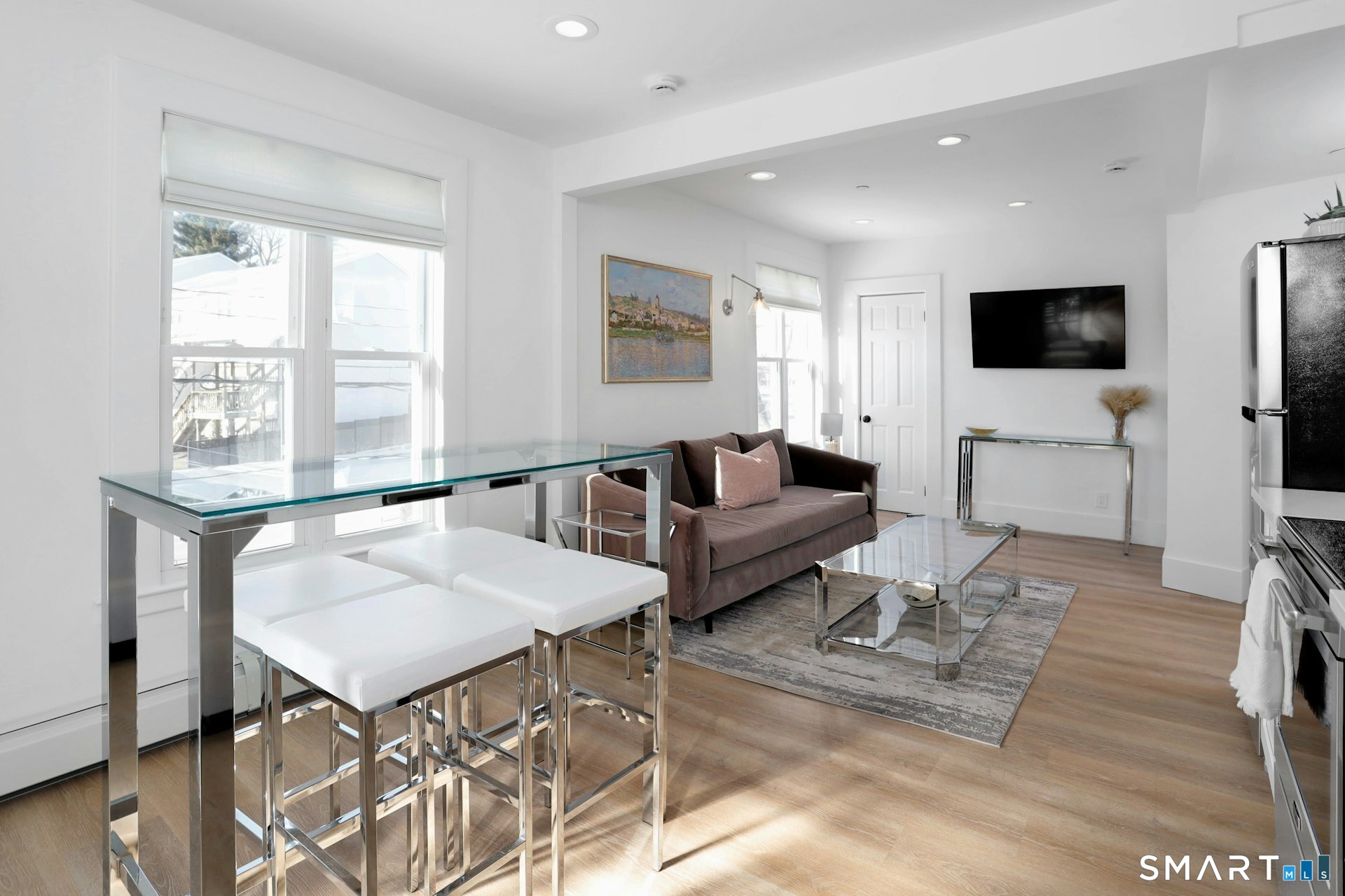 225 Washington Boulevard Stamford, CT 06902 - Photo 16 of 35 a living room with furniture and a flat screen tv