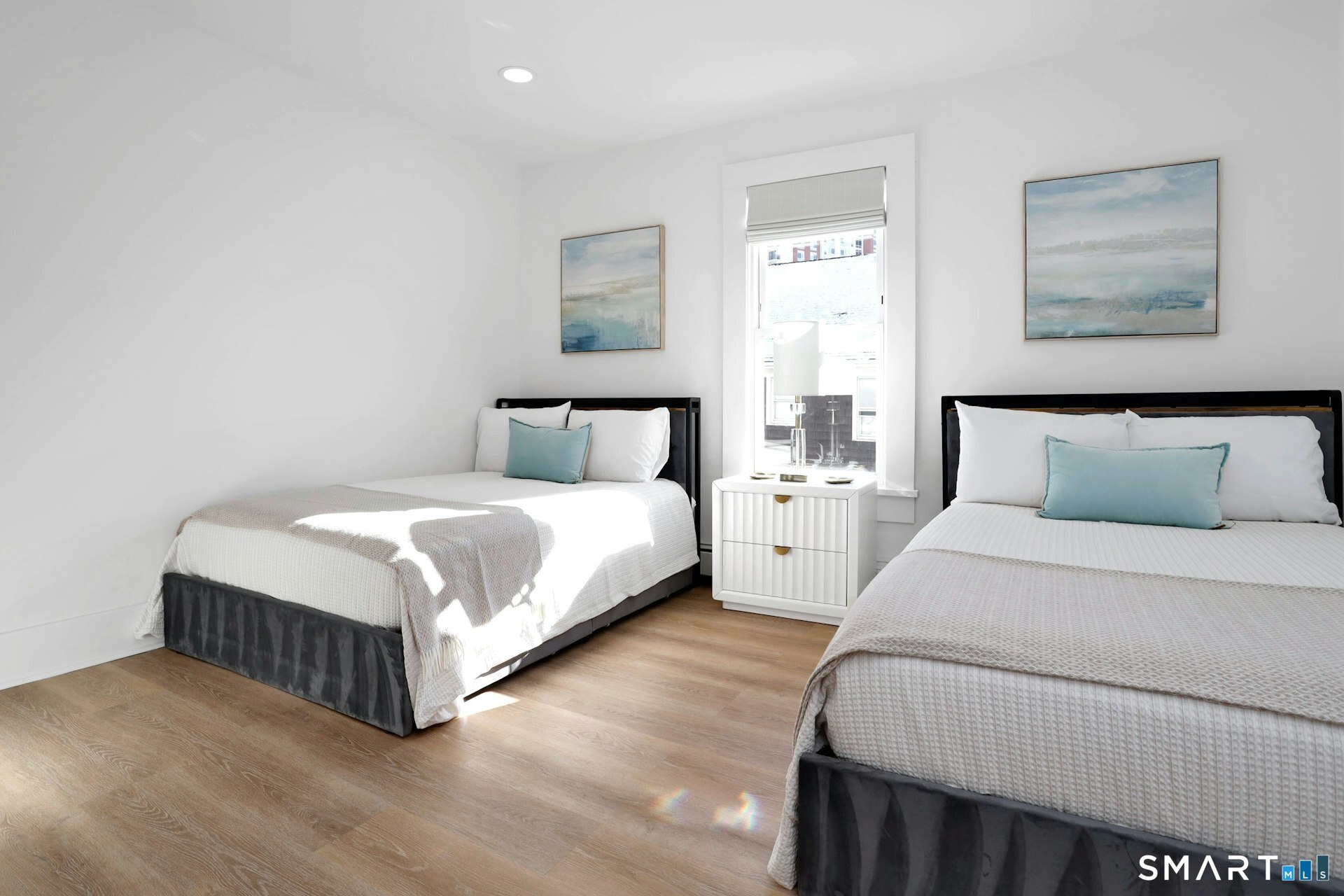 225 Washington Boulevard Stamford, CT 06902 - Photo 23 of 35 a bedroom with a bed and night stand