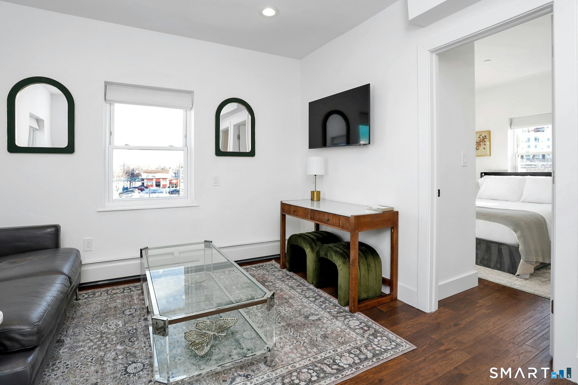 225 Washington Boulevard Stamford, CT 06902 - Photo 26 of 35 a living room with furniture and a fireplace