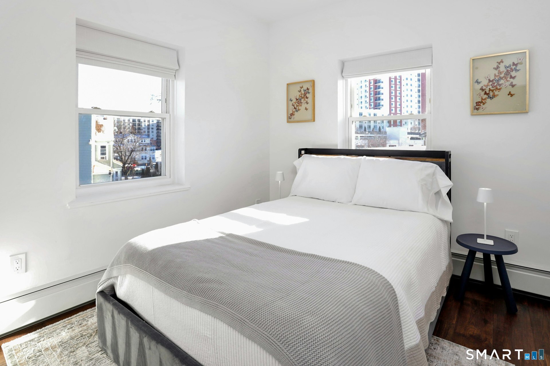 225 Washington Boulevard Stamford, CT 06902 - Photo 30 of 35 a bedroom with a bed and a window