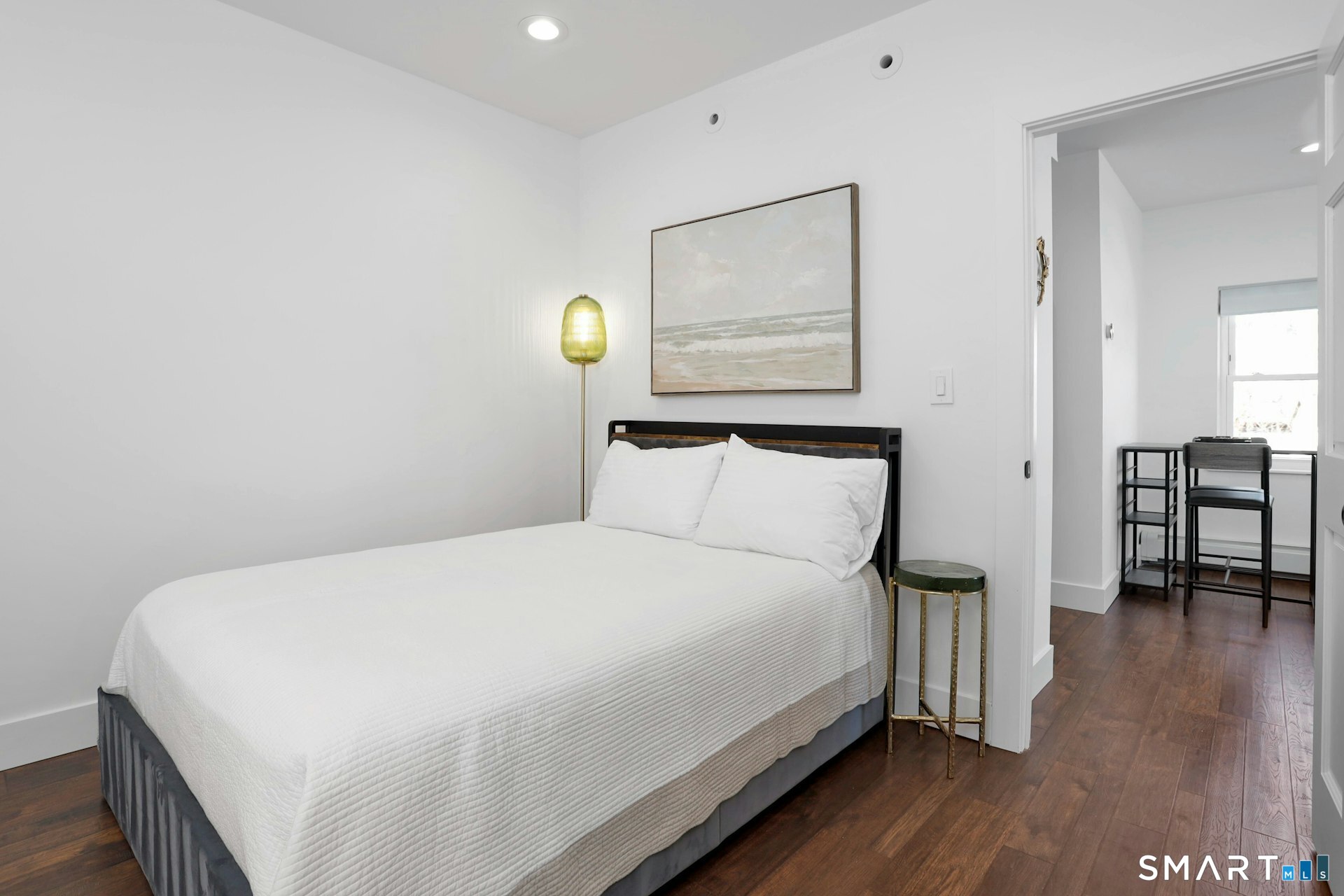 225 Washington Boulevard Stamford, CT 06902 - Photo 31 of 35 a bedroom with a bed and wooden floor