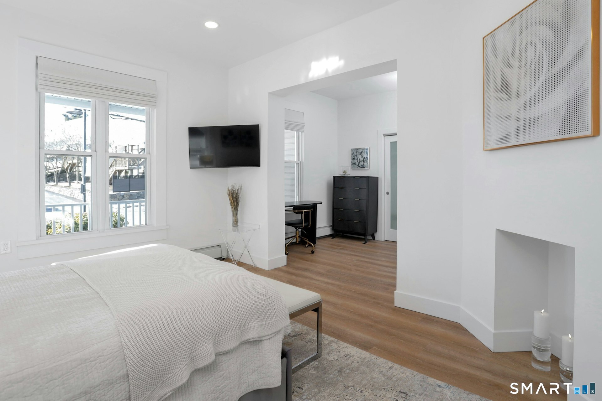 225 Washington Boulevard Stamford, CT 06902 - Photo 5 of 35 a bedroom with a bed and a flat screen tv