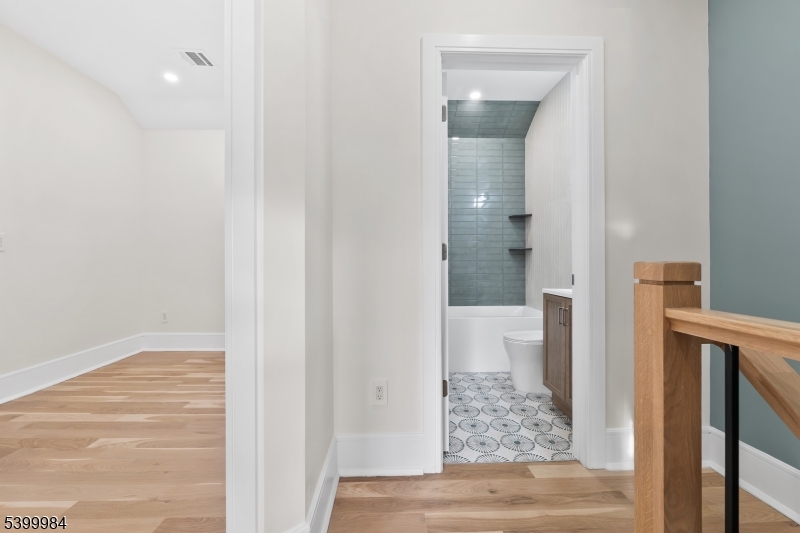1453 Morris Avenue Union, NJ 07083 - Photo 11 of 48 a view of a bathroom from a corridor