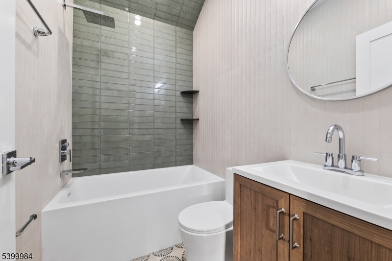 1453 Morris Avenue Union, NJ 07083 - Photo 16 of 48 a bathroom with a sink a toilet and a bathtub