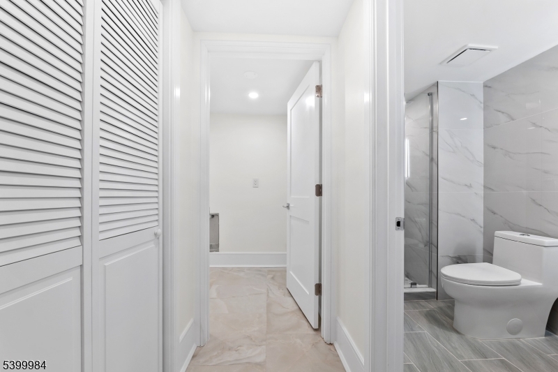 1453 Morris Avenue Union, NJ 07083 - Photo 20 of 48 a bathroom with a toilet and a shower